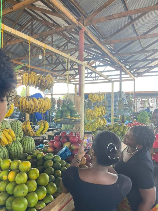 Dar es Salaam: Taste of Tanzania Cooking Class and Food Tour - Sitting down to eat what you prepared