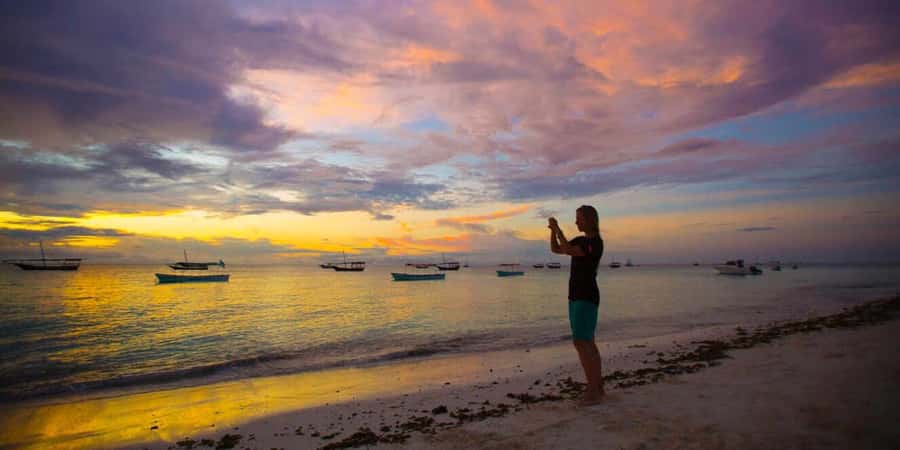 From Nungwi: Guided Sunset Dhow Cruise - The Nungwi beach walk and photo stop