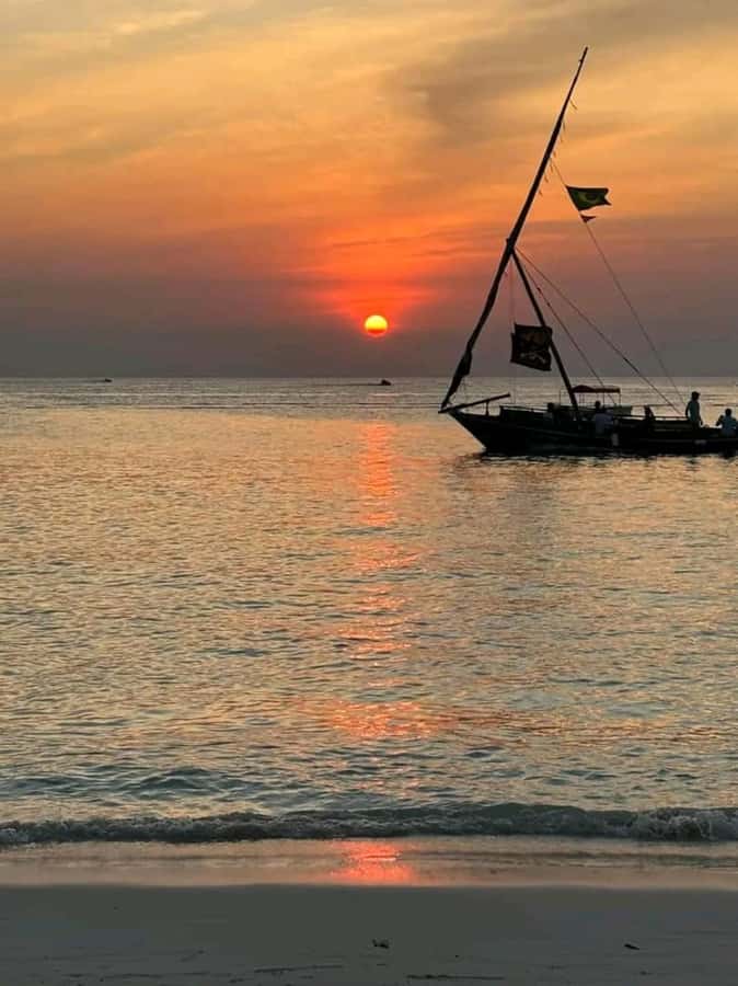 FROM NUNGWI; SUNSET DHOW CRUISE EXPERIENCE - Leaving Nungwi Beach on a traditional dhow