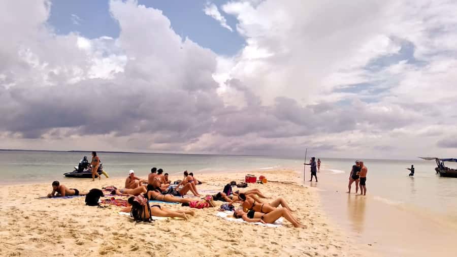From Stone Town: Sandbank picnic with sea food BBQ Lunch - Stretching out on an untouched sandbank