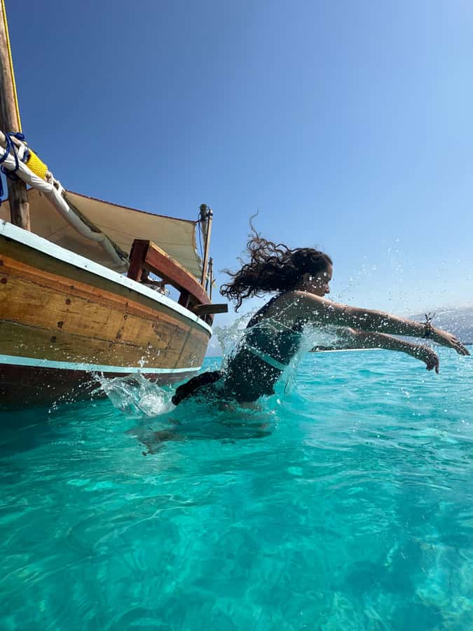 Matemwe: Mnemba Island Dolphin & Snorkeling Boat Trip - Searching for dolphins around Mnemba