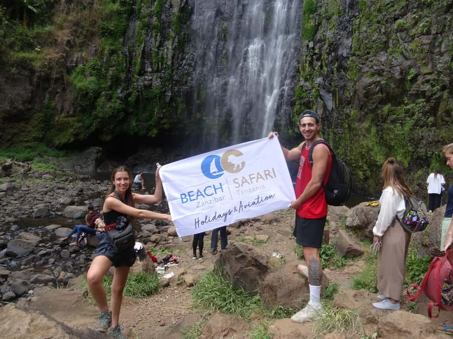 Moshi/Arusha: Chemka Hot Springs Materuni Waterfall Day tour - Walking the 40-minute trail to Materuni Waterfall