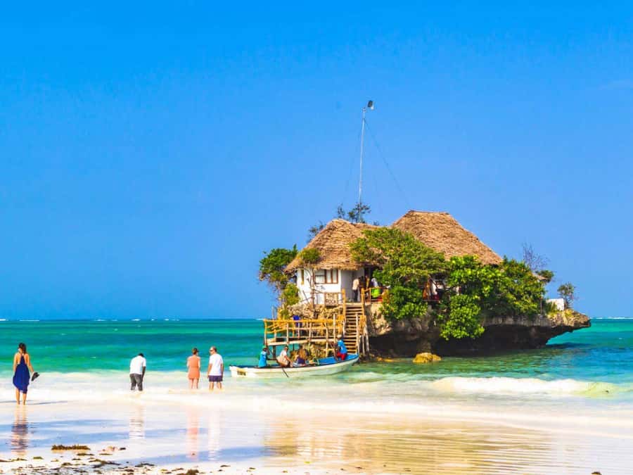 Salaam Cave Tour, Lunch at The Rock, Mnemba Snorkeling - Paje Village and its broad white beach